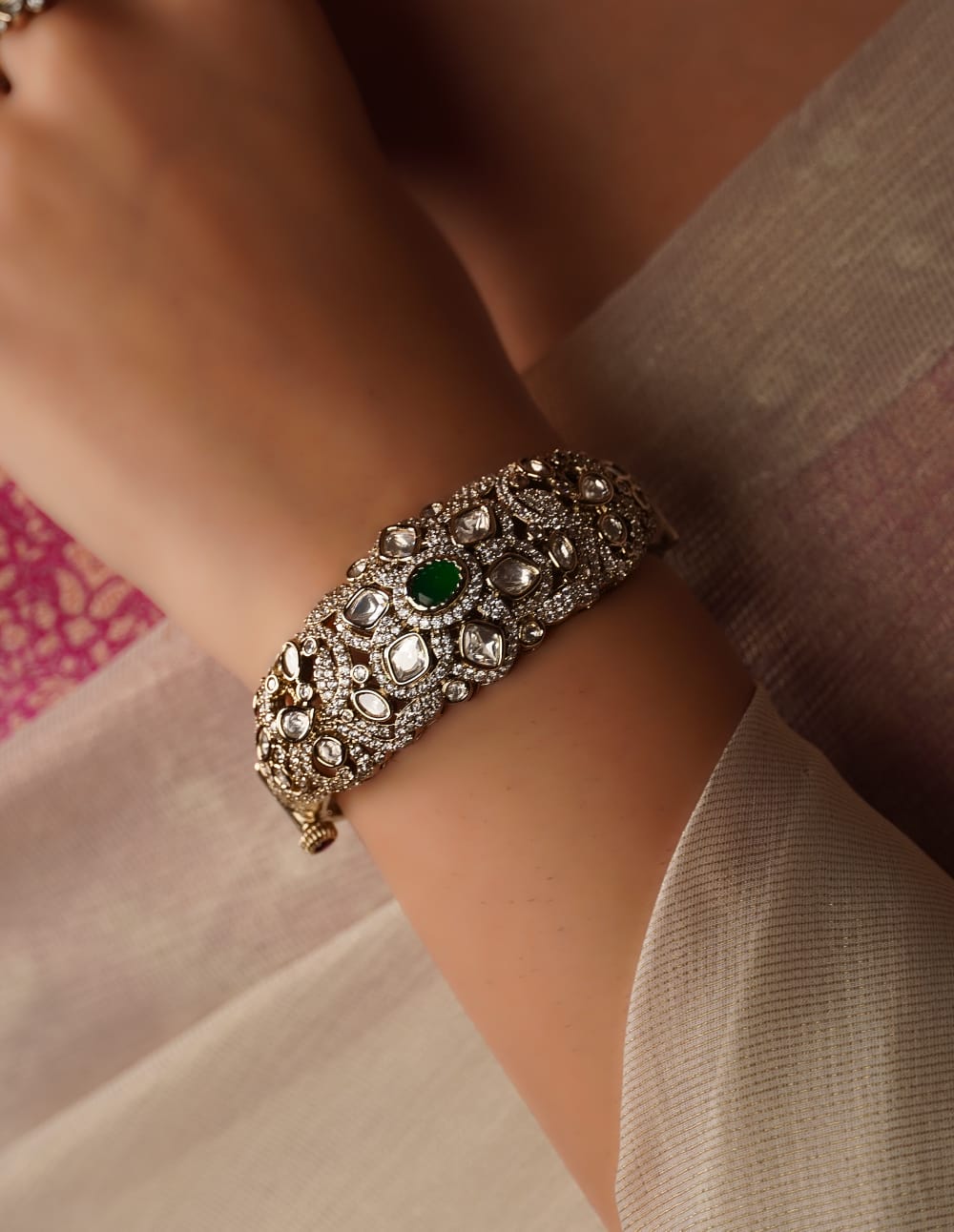 Emerald and diamond studded silver bangle